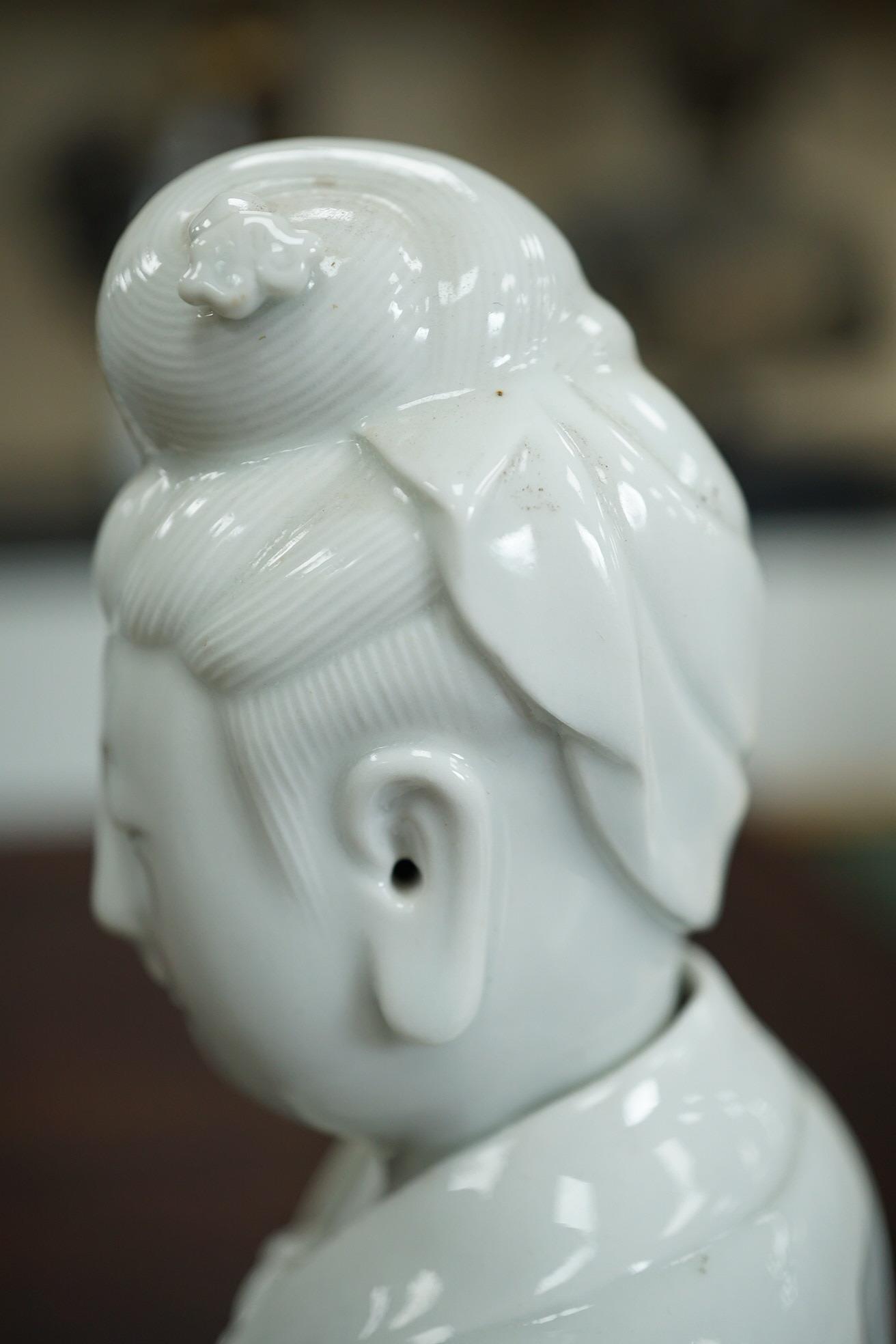A Chinese blanc-de-chine seated figure of Guanyin, late 19th/early 20th century